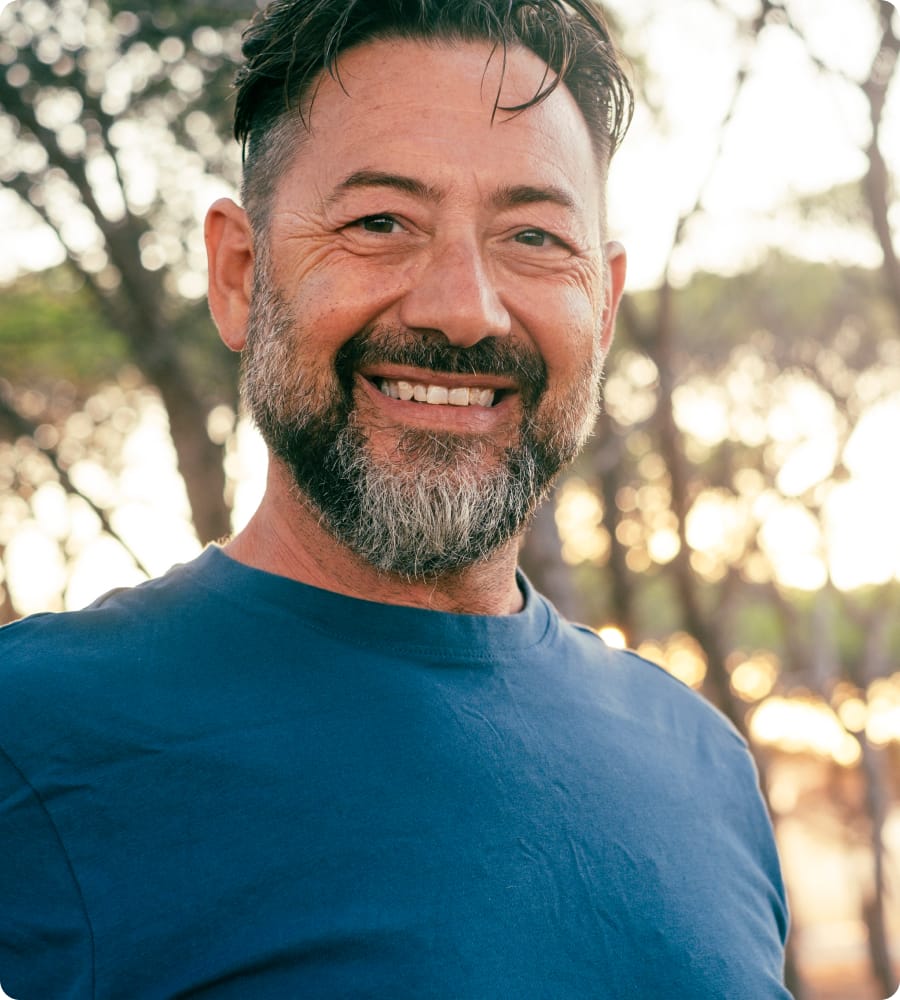 Man in a blue shirt smiling