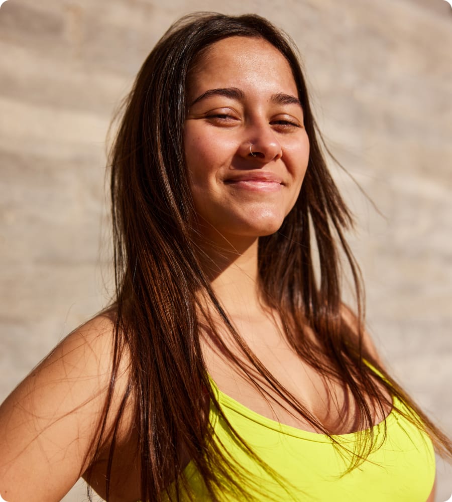 Woman in a yellow top, smiling
