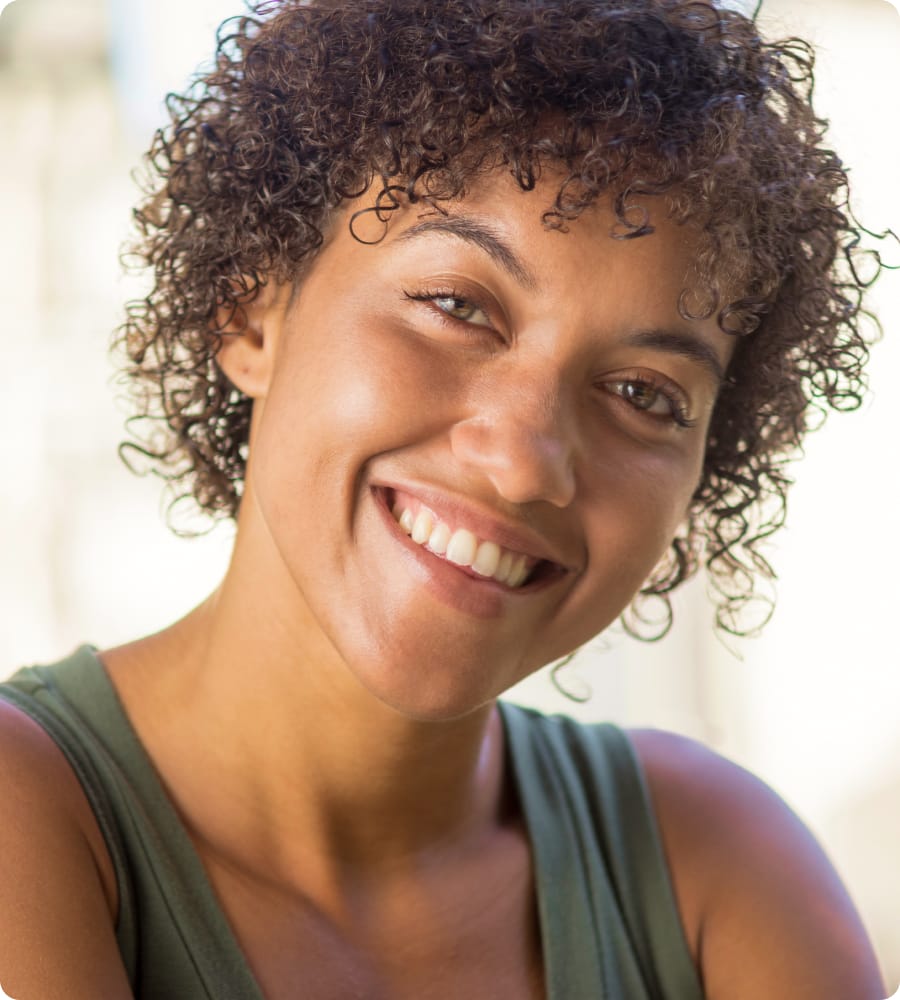 Woman with curly hair, smiling