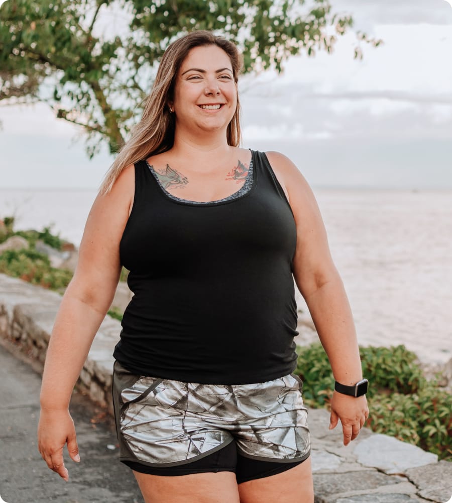 Woman walking next to the ocean