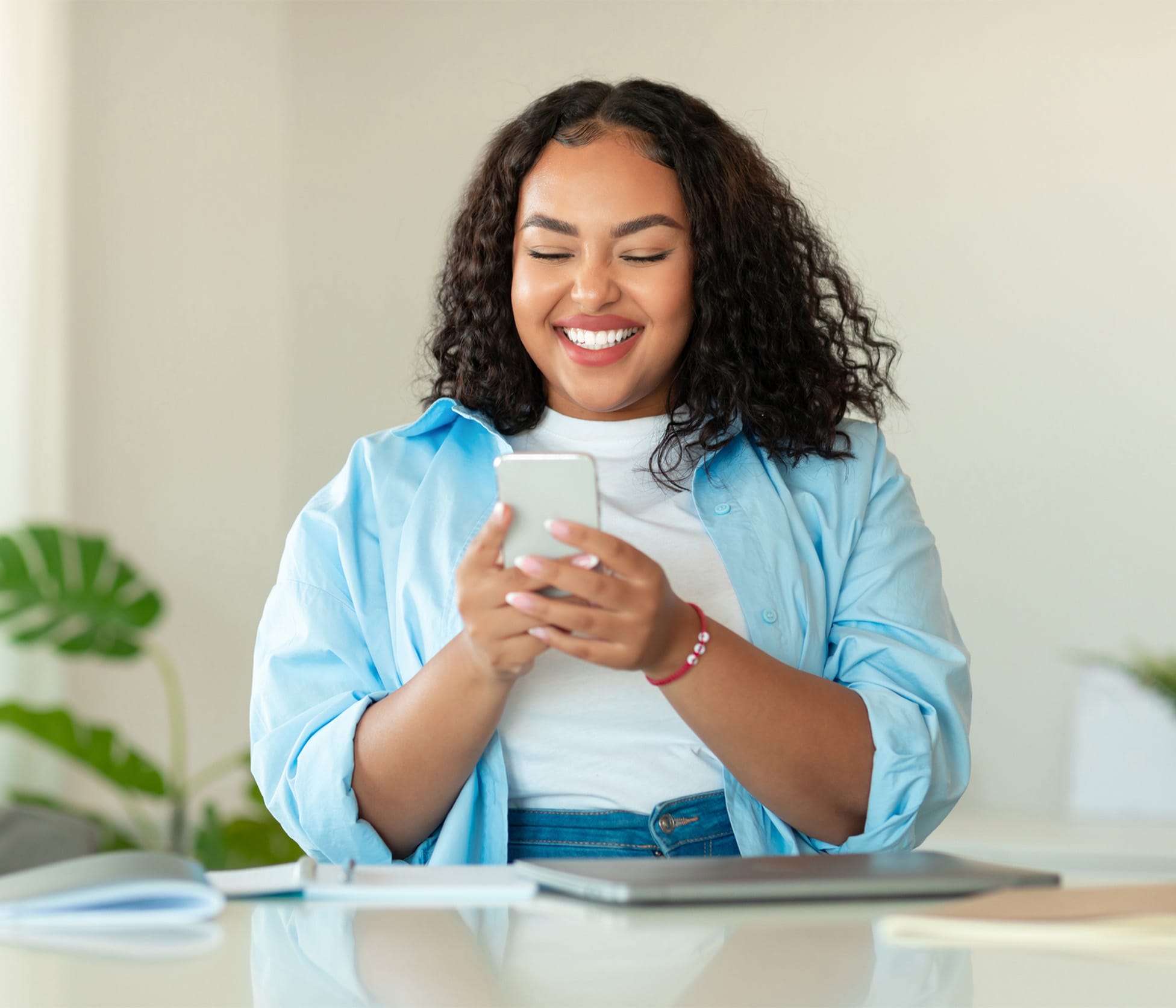 Woman smiling looking at phone