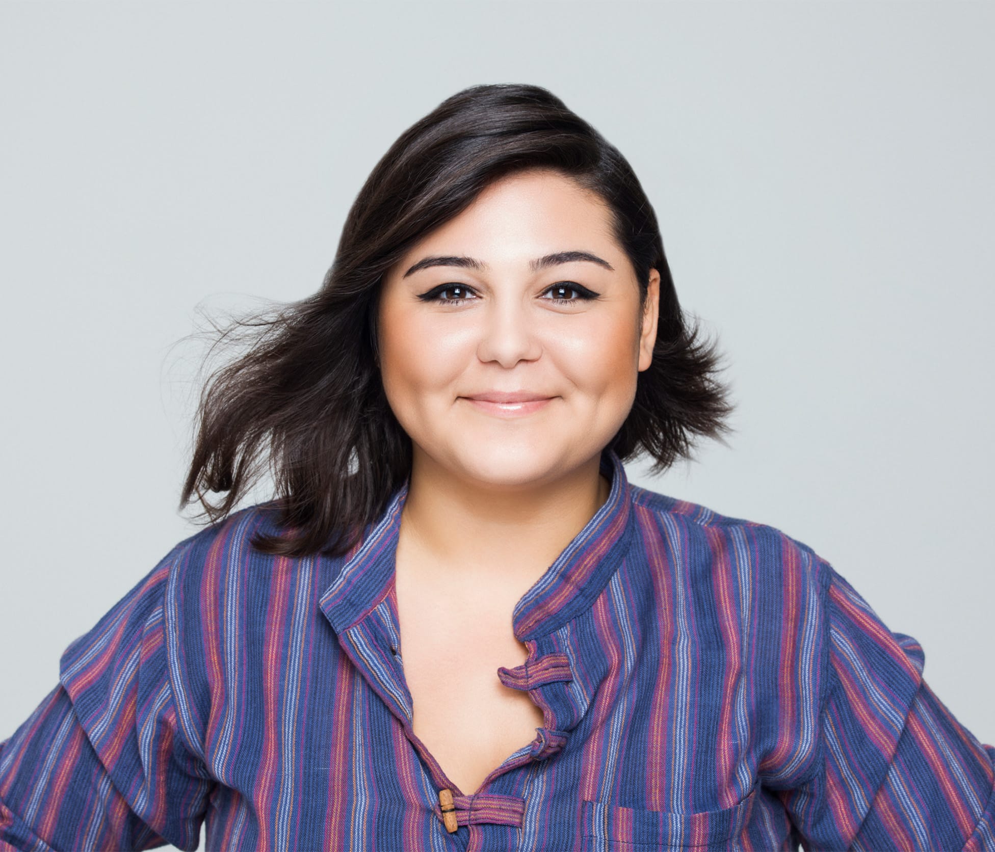 Woman smiling with gray background