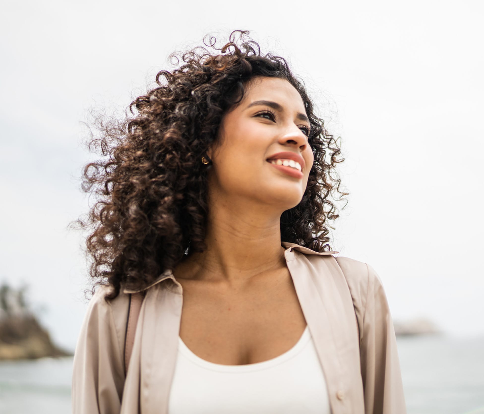 Woman smiling and standing outside